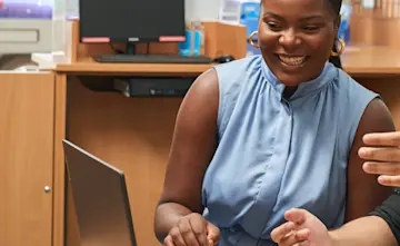 Explore Learning manager at a laptop