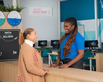 Explore Learning manager discussing child's progress with parent