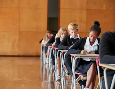 Teenagers sitting a GCSE exam