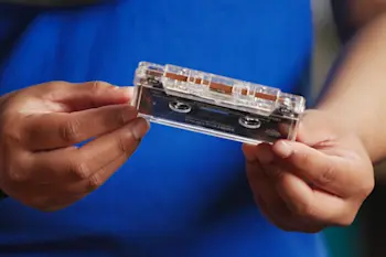 Someone holding a cassette tape