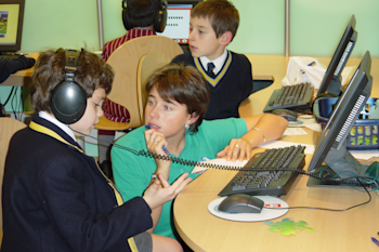 Photo of an Explore Learning tutor teaching students using cutting edge technology in 2001
