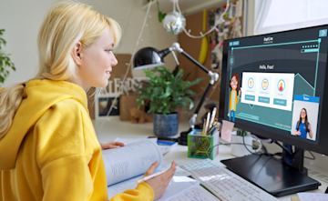Young girl logging into her online tuition portal to access her bespoke curriculum with an Explore Learning tutor.