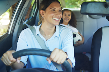 Mother driving children in the car