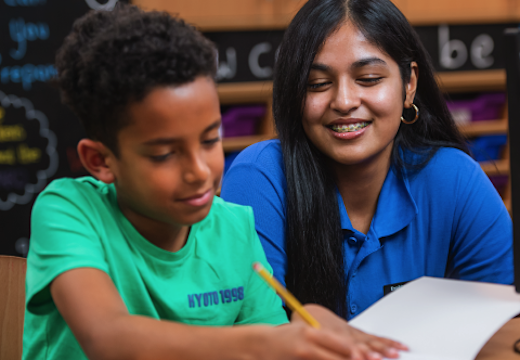 Tutor helping student with 11+ tuition
